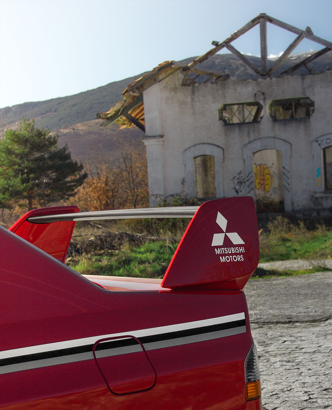 Detalle del alerón del Mitsubishi Lancer Evo tras la ruta en coche desde Madrid